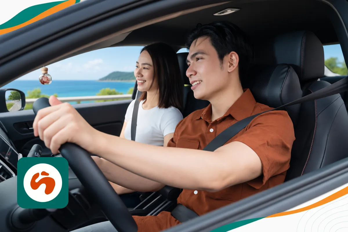 Two travellers sharing the driving of a rental car in Malaysia